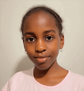 Grade 7 student with black hair in braids, wearing a light top, standing upright and facing the camera. Photo centred on a blue graphic background.