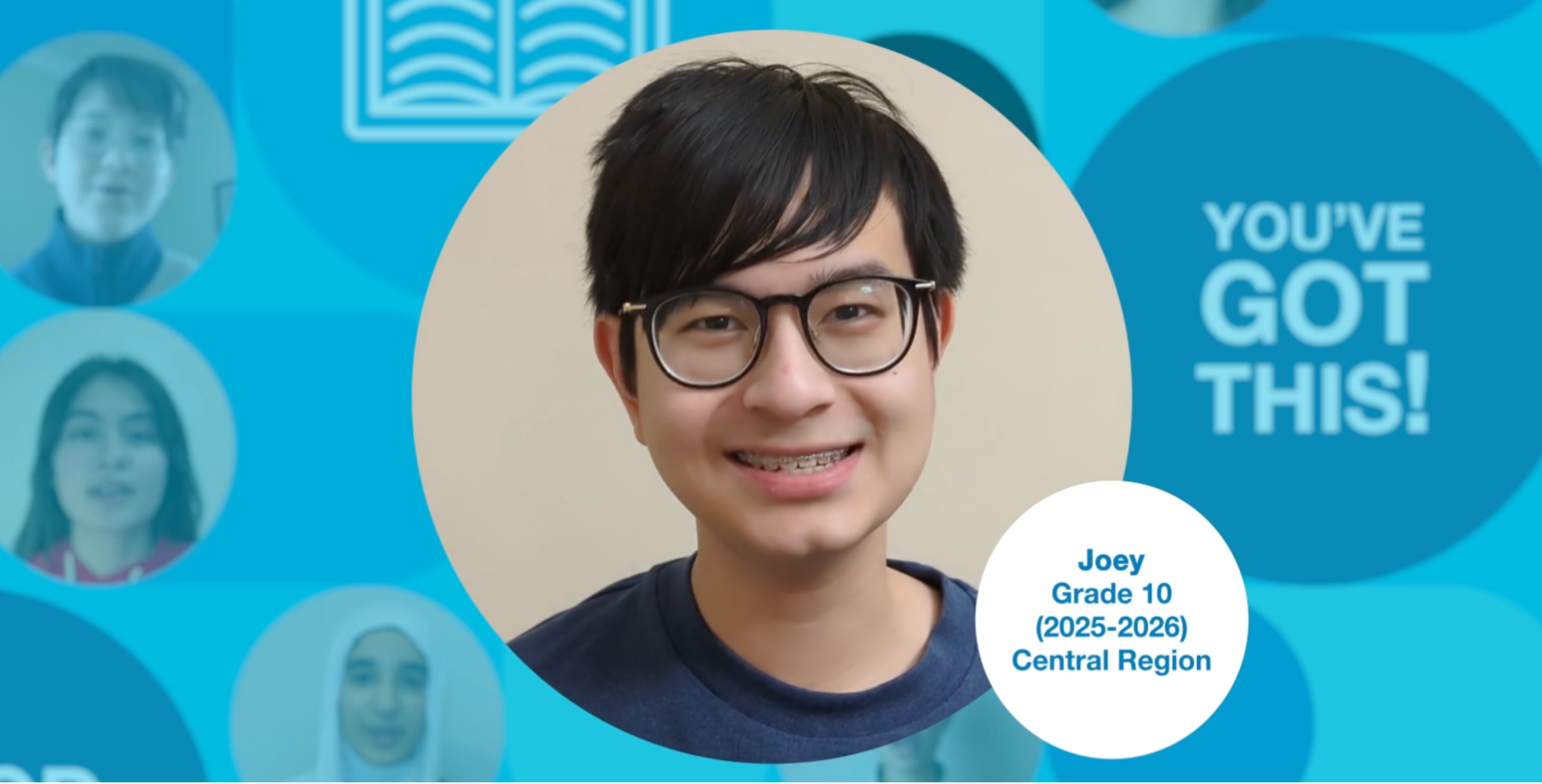 Grade 10 student with short dark hair, wearing glasses and a blue t-shirt, upright and facing the camera. Photo centred on a blue graphic background.