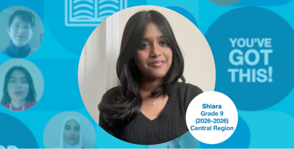 Grade 9 student with long dark hair, wearing a black top, standing upright and facing the camera. Photo centred on a blue graphic background.